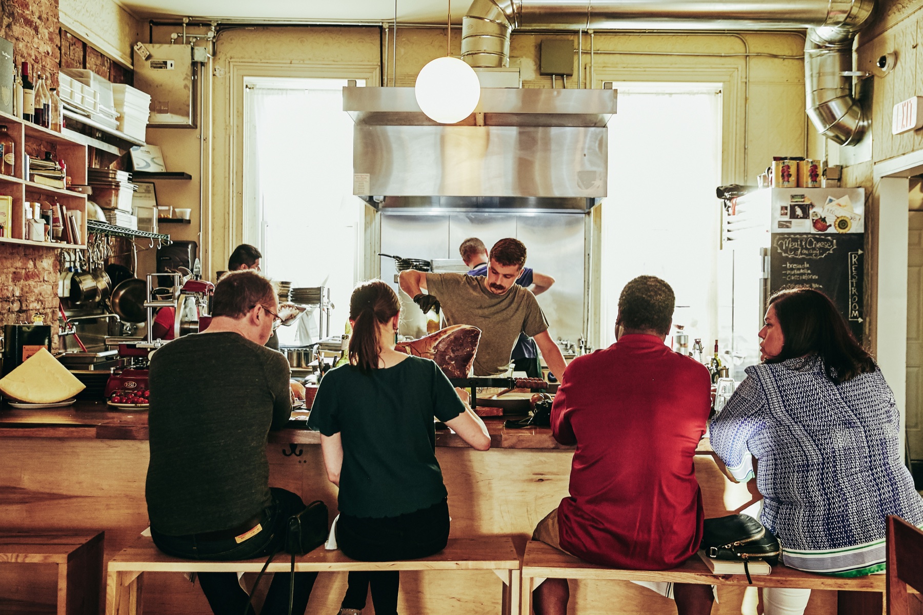 Matt Moschella working at the open kitchen counter